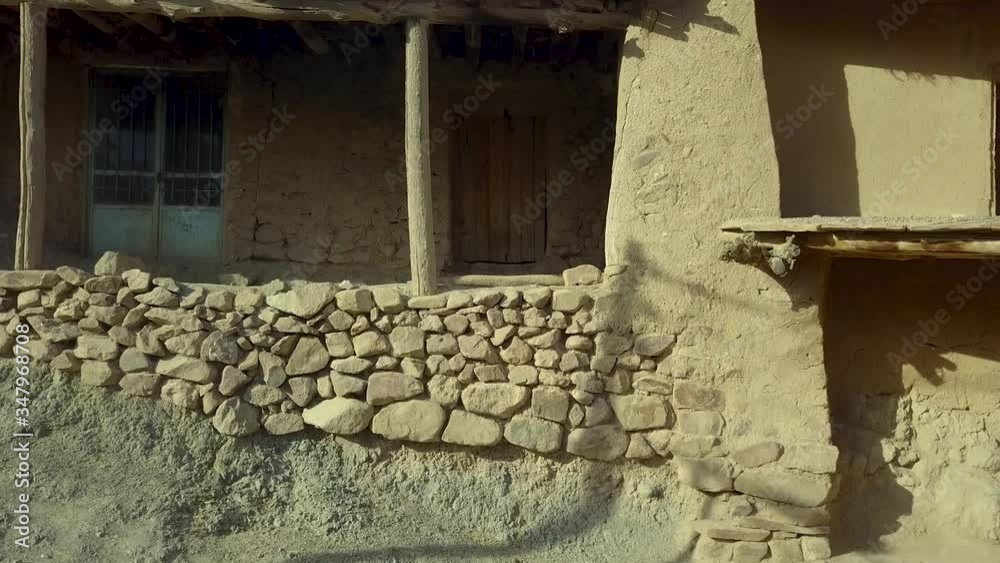 Aerial ancient stone rural house made by clay and stone with desert back ground landscape in Iran Aerial ancient stone rural house made by clay and stone with desert back ground landscape in Iran