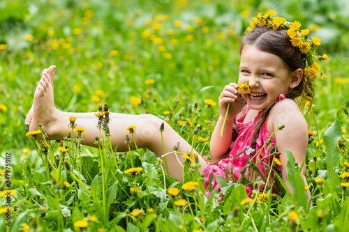 Girl posing with dandelions like a model