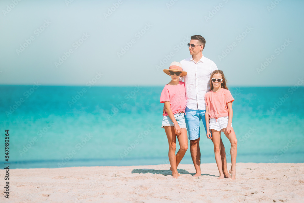 Happy beautiful family on a tropical beach vacation Happy beautiful family on a tropical beach vacation