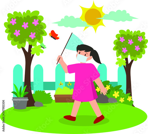 Young girll catching a butterfly on yard while using medical mask