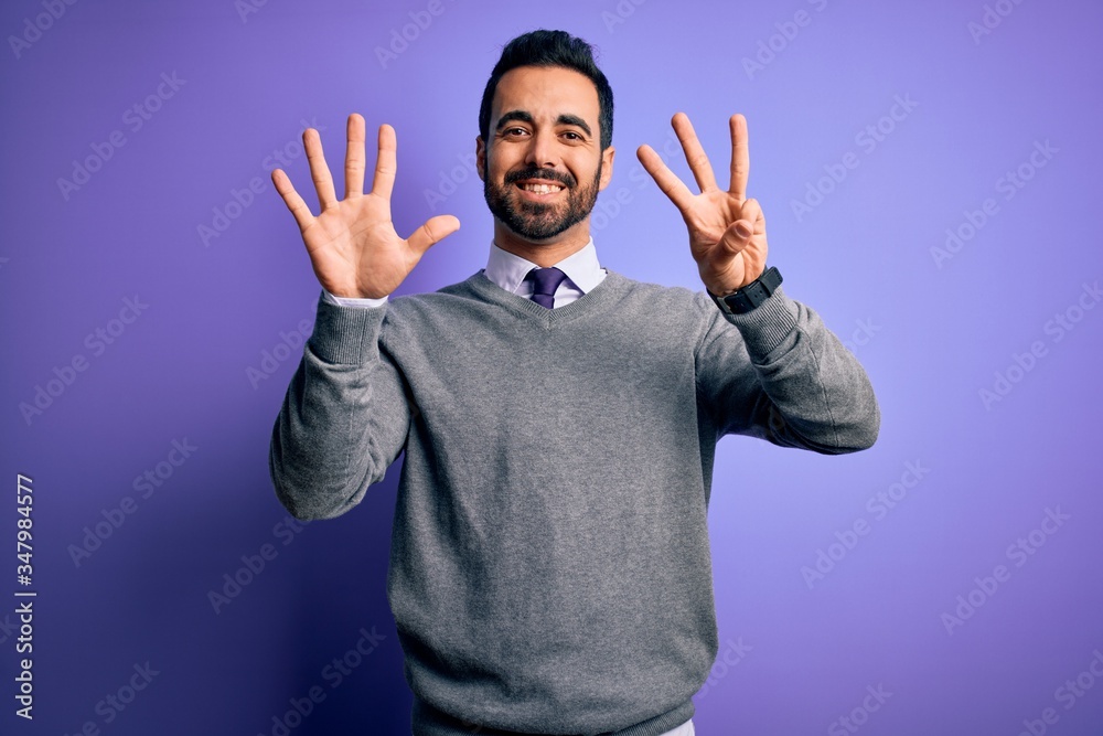 Handsome businessman with beard wearing casual tie standing over purple background showing and pointing up with fingers number eight while smiling confident and happy. Handsome businessman with beard wearing casual tie standing over purple background showing and pointing up with fingers number eight while smiling confident and happy.