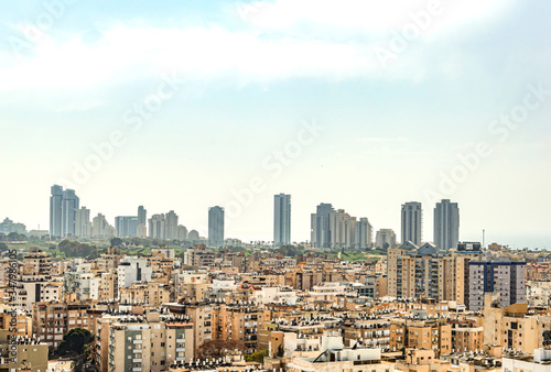 City with high-rise buildings and hotels on a background of sky