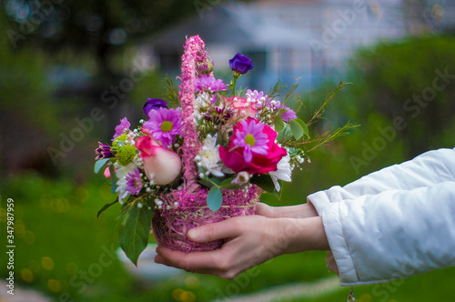 hands holding a bouquet of flowers