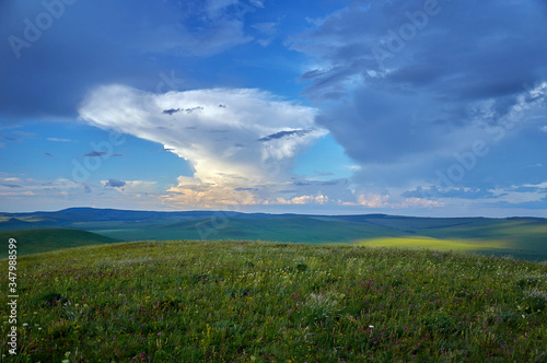 Steppes and distant green hills in the rain. Zabaykalsky Krai. Russia.
