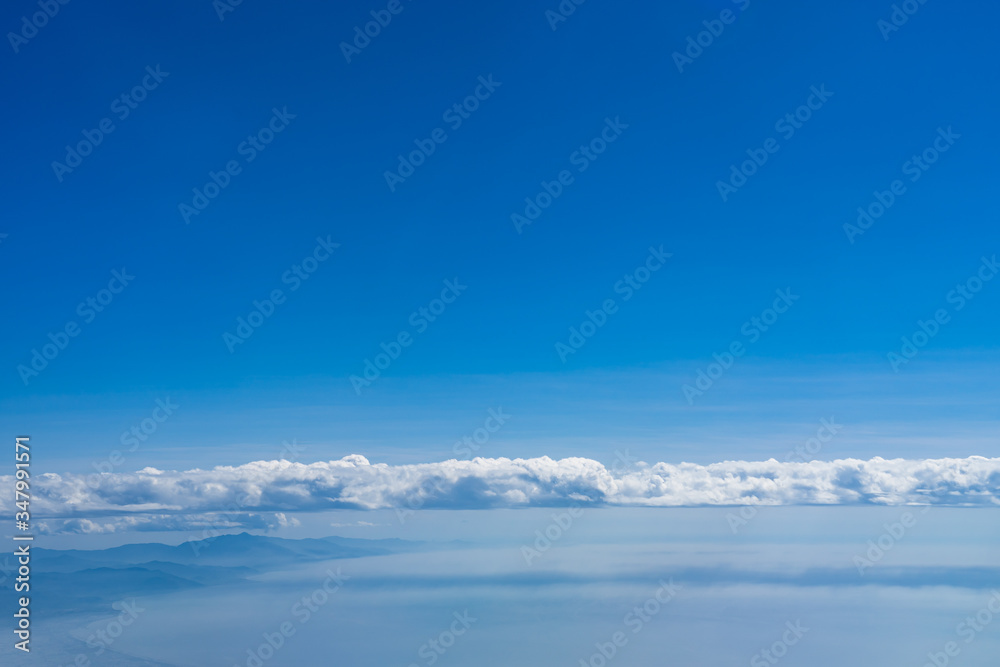 Clouds, Mountain range and coastline with blue sky background Clouds, Mountain range and coastline with blue sky background