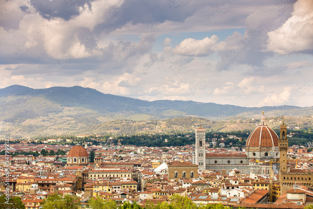 Florence. Tuscany, Italy.Beautiful views of the facade of the Cathedral of St. Mary of the Flower (Cathedral of Santa Maria del Fiore) the tiled roofs of the nearest dwellings.