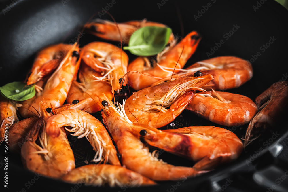 Fried shrimps with spices on pan Fried shrimps with spices on pan