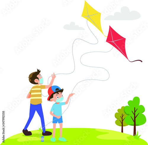 Siblings are playing kite together on the field while using medical mask