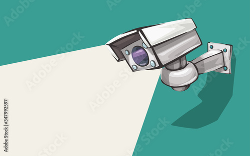 white security camera on green