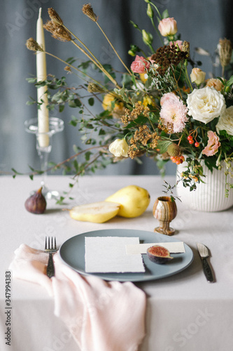 festive dining table with appliances for two and a beautiful wedding decor