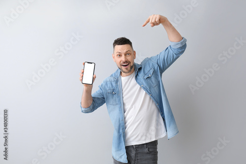 Handsome man with mobile ph...