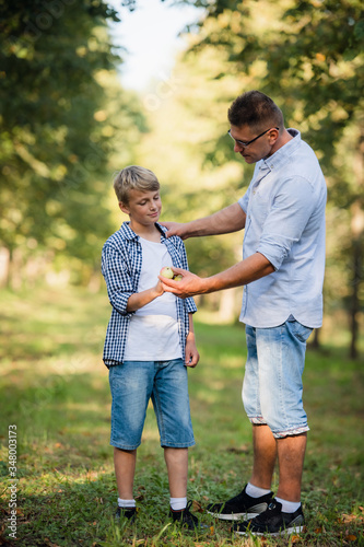 Father and son in the park or forest for a walk © romankosolapov