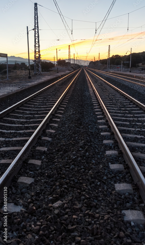 sunset on the train tracks in Avila, Spain