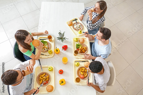 Pupils having lunch at scho...