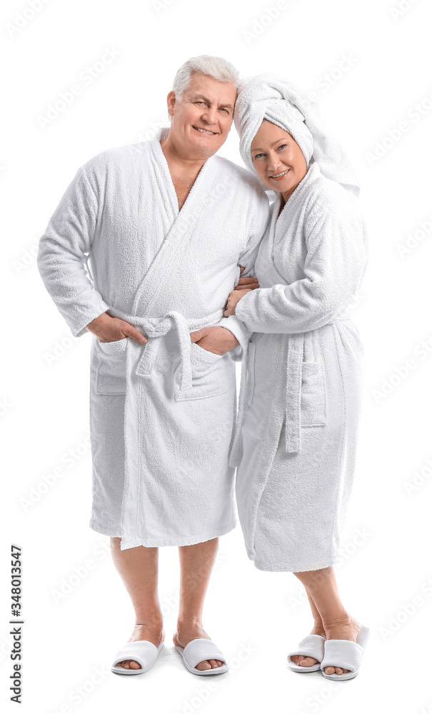 Mature couple in bathrobes on white background Mature couple in bathrobes on white background