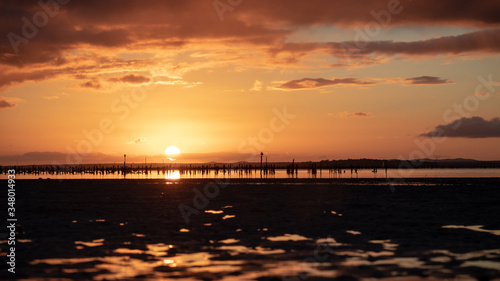 Sunset Port Stephens full sun with clouds during the golden hour and sun reflections