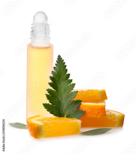 Bottle of citrus roll-on perfume on white background photo