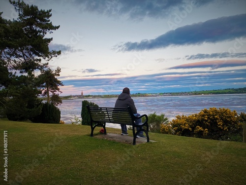 silhouette of a man on a bench