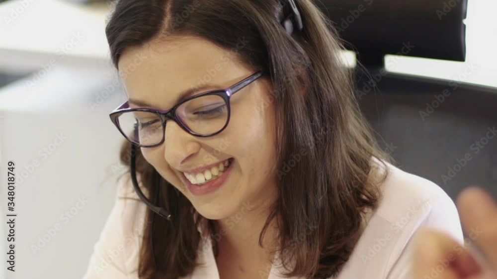 Beautiful business women wearing glasses working in call center
