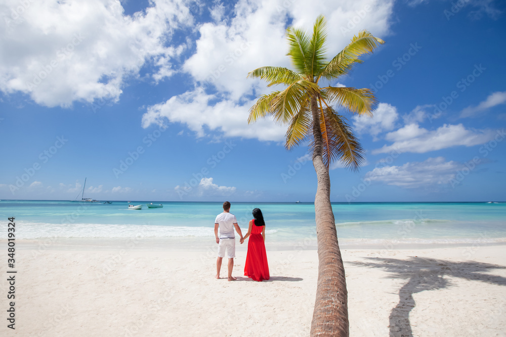 Romantic Couple In Love Hugging Kissing And Running On The Sandy Tropical Caribbean Beach In