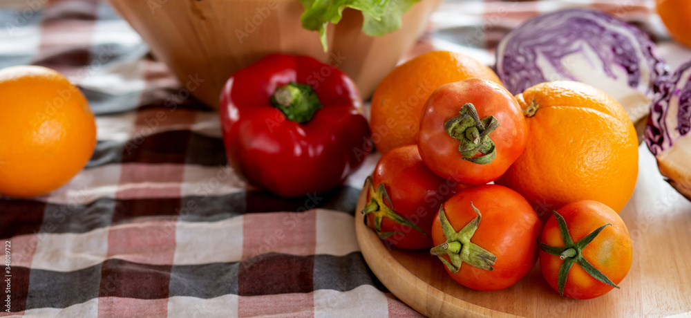 Fresh organic raw vegetable and fruit in bowl for salad on table, vegetarian and healthy food or ingredient and herb for cooking health with copy space, harvest for farm, banner website. Fresh organic raw vegetable and fruit in bowl for salad on table, vegetarian and healthy food or ingredient and herb for cooking health with copy space, harvest for farm, banner website.
