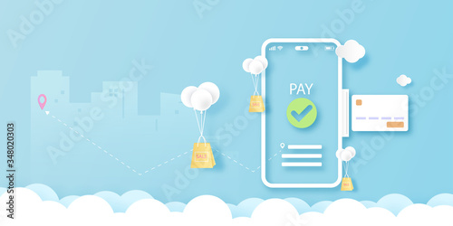 Smart phone on blue sky with online shopping,payment and delivery service concept landing page template background.Paper art Vector illustration.