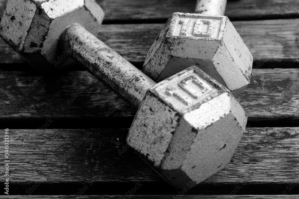 old rusty unused iron weights in black and white old rusty unused iron weights in black and white