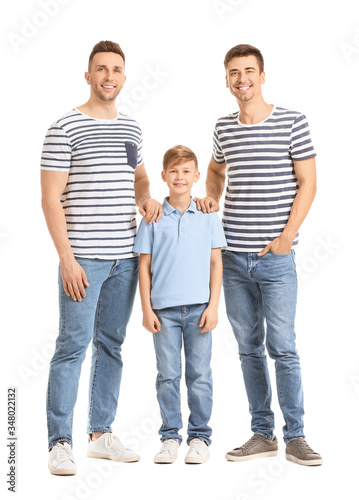 Happy gay couple with adopted child on white background © Pixel-Shot