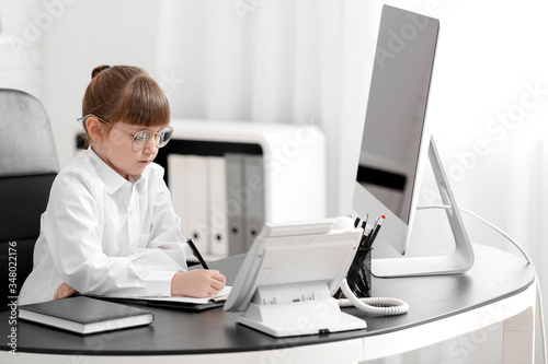 Little secretary working in...