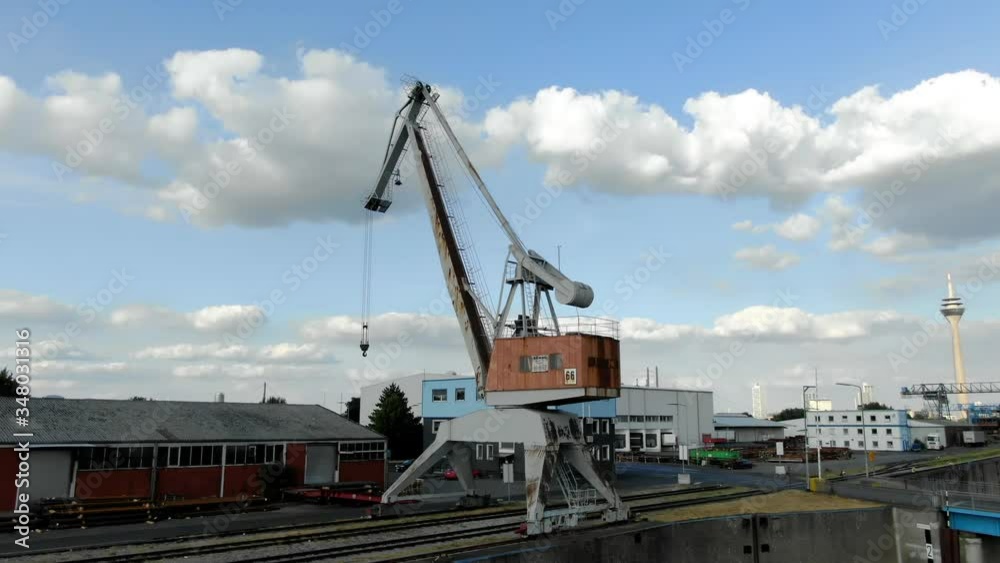 Drone shot of an old industrial crane in a harbour Drone shot of an old industrial crane in a harbour