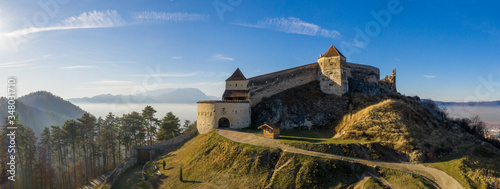 Aerial drone panoramic view of Historical fortress in Risnov or Rasnov. Romania photo