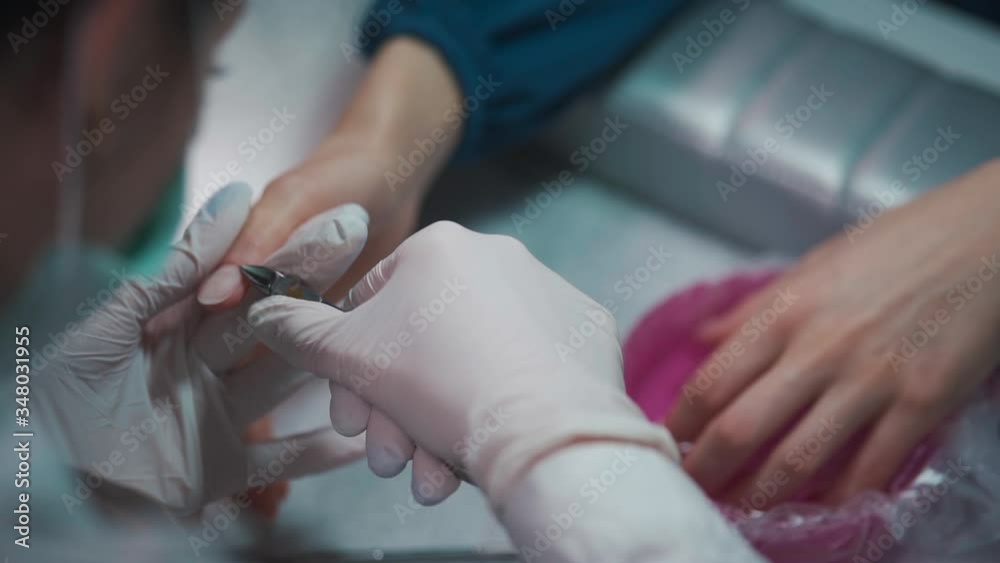 closeup shot and manicure artist making nail cleaning and polishing closeup shot and manicure artist making nail cleaning and polishing