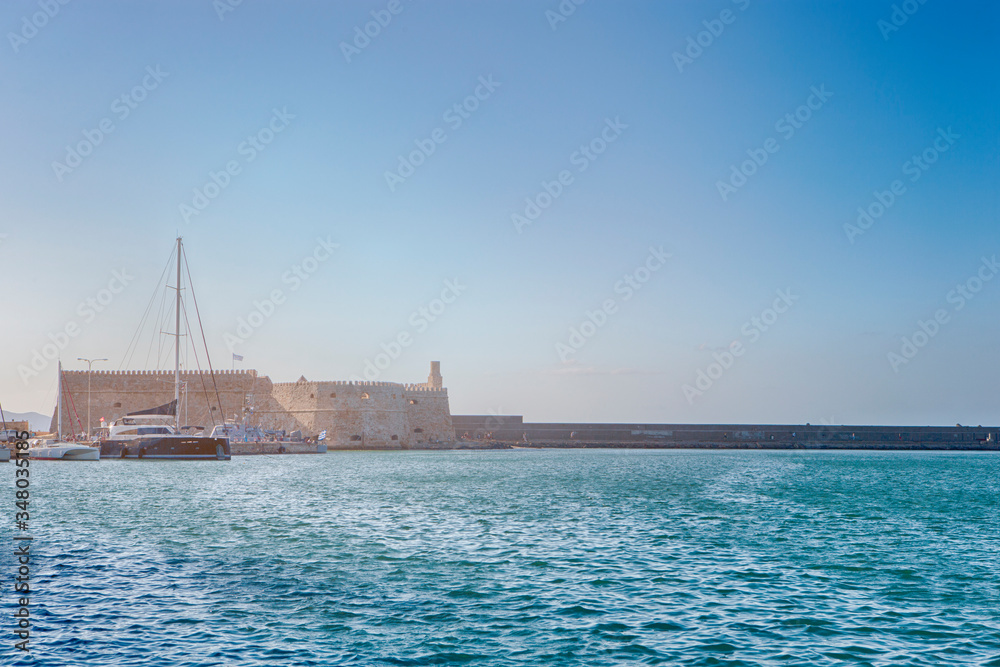 Greek Travel. Koules Fortress with Sailing Boats At Noon in Heraklion City, Greece.