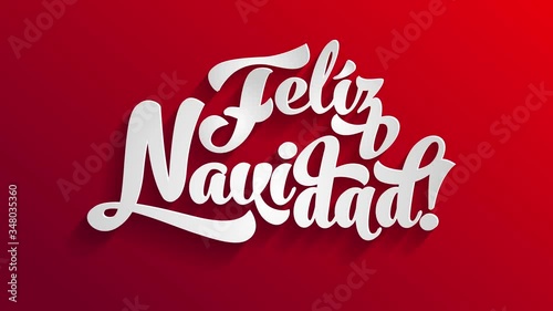 spanish merry christmas feliz navidad written on white 3d typography over a bright red surface