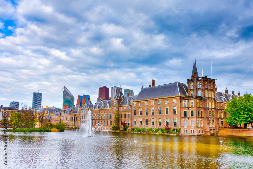 Binnenhof Palace of Parliament inThe Hague in The Netherlands At Daytime. Against Modern Skyscrapers on Background.