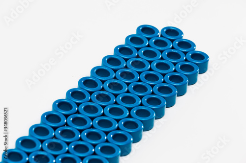 Electronic Components Concepts. Closeup of Variety of Ferrite Magnetic Cores of Blue Color. Isolated On White. photo