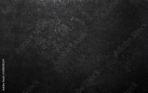 Dark grey black natural stone slate background or texture.