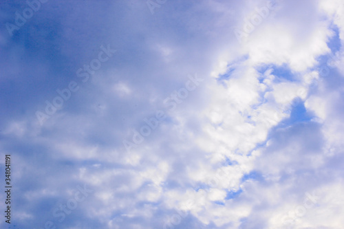 a photo of a cloud in the bright blue sky in the morning  looking very beautiful and charming.