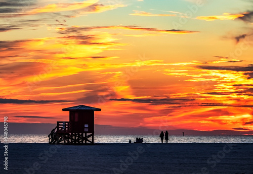 sunset on the beach, sea, sky, water, ocean, beach, clouds, lifeguard, silhouette, tower, evening, orange, yellow, Siesta Key, Florida