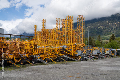 many industrial cranes ready to be installed on construction sites photo