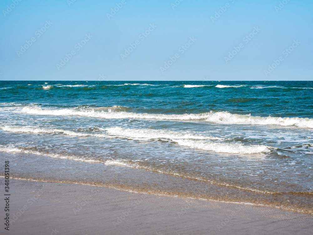 Seascape, sea waves breaking on the shore.
