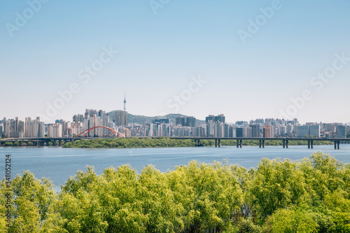 Modern apartment buildings and Han river park in Seoul, Korea photo