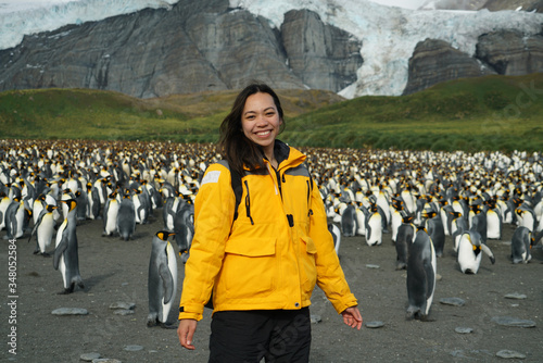 Woman standing in front of Penguin Colony