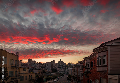 High angle view of homes on the famous crooked Lombard Street, San Francisco California with fiery skies at sunset