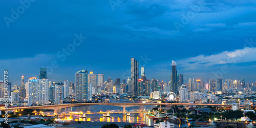 photos of modern city and tall buildings in Bangkok in the evening