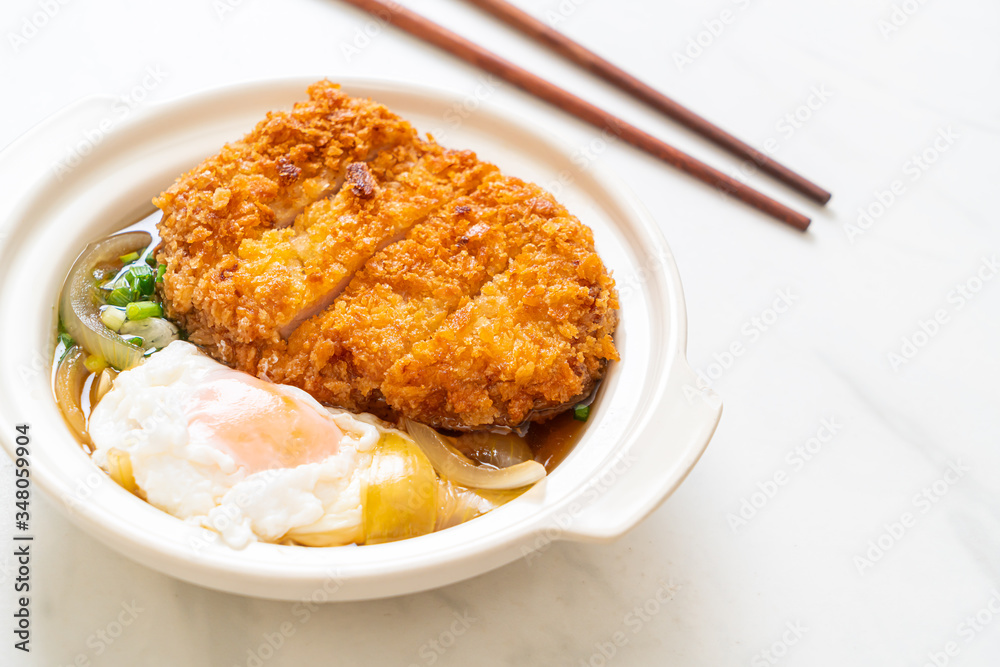 Japanese fried pork cutlet (katsudon) with onion soup and egg Japanese fried pork cutlet (katsudon) with onion soup and egg
