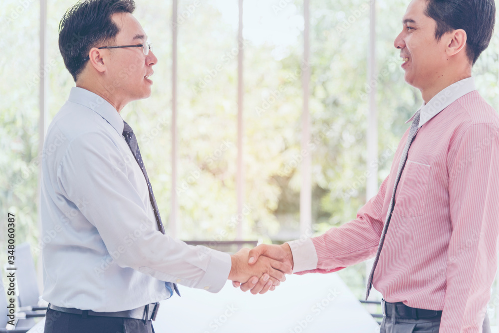 Team Business Partners shaking hands together to Greeting Start up new project. Shakehand Teamwork Partnership outside office modern city background. Businessman handshake together. Business concept Team Business Partners shaking hands together to Greeting Start up new project. Shakehand Teamwork Partnership outside office modern city background. Businessman handshake together. Business concept