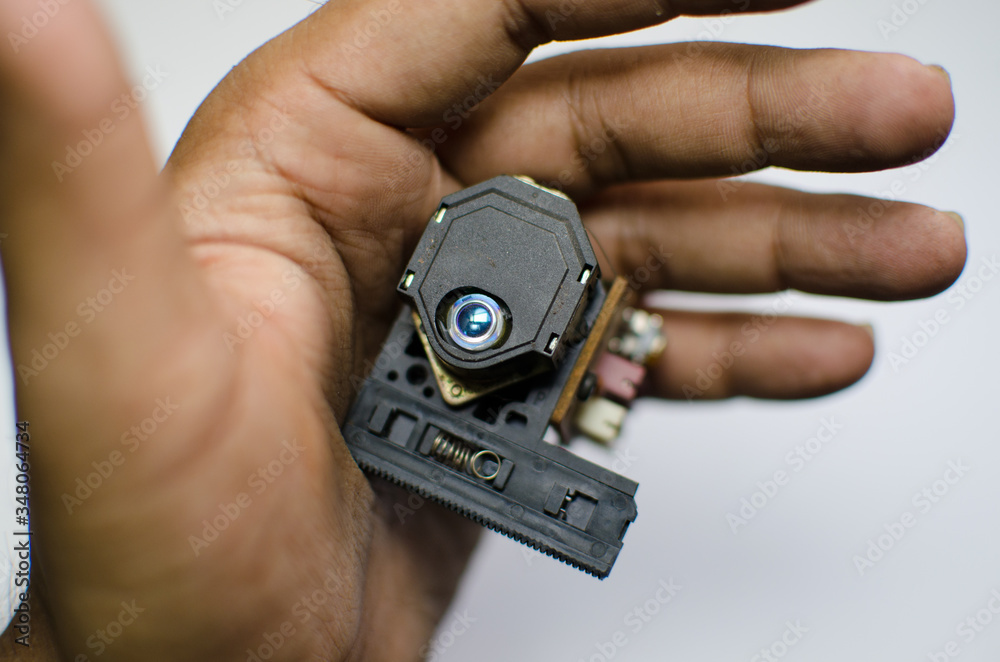 random old electrical part in human hand random old electrical part in human hand