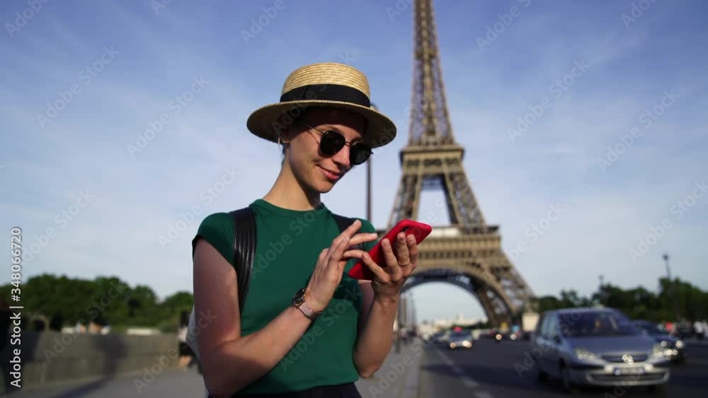 Slow motion of young woman traveler in casual wear typing text message on smartphone standing on street with Eiffel Tower on background.Female tourist searcing sightseeing in Paris on website
Slow motion of young woman traveler in casual wear typing text message on smartphone standing on street with Eiffel Tower on background.Female tourist searcing sightseeing in Paris on website
