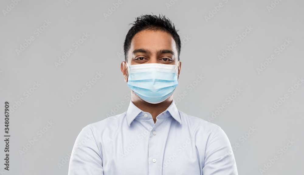 business, healthcare and people concept - portrait of indian man in shirt wearing face medical mask for protection from virus disease over grey background business, healthcare and people concept - portrait of indian man in shirt wearing face medical mask for protection from virus disease over grey background